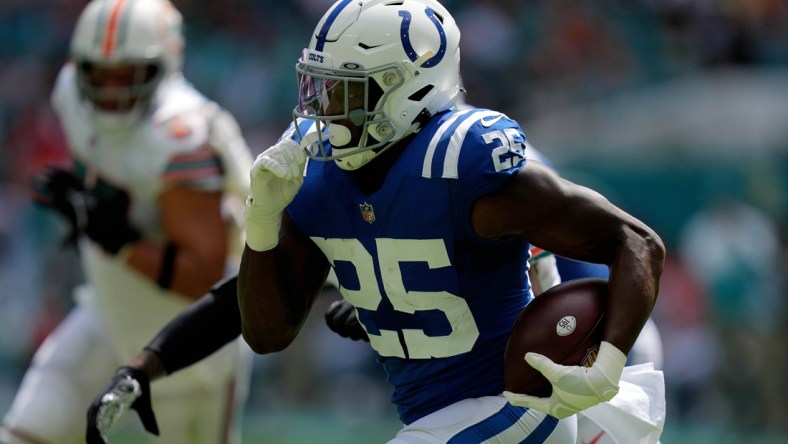 Oct 3, 2021; Miami Gardens, Florida, USA; Indianapolis Colts running back Marlon Mack (25) runs the ball against the Miami Dolphins during the first half at Hard Rock Stadium. Mandatory Credit: Jasen Vinlove-USA TODAY Sports