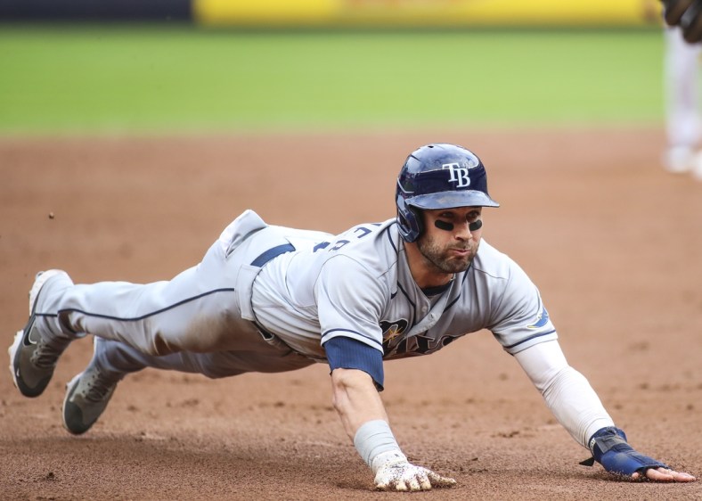 Oct 3, 2021; Bronx, New York, USA; Tampa Bay Rays center fielder Kevin Kiermaier (39) slides into third base in the third inning against the New York Yankees at Yankee Stadium. Mandatory Credit: Wendell Cruz-USA TODAY Sports