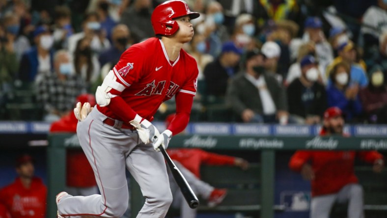 Oct 3, 2021; Seattle, Washington, USA; Los Angeles Angels designated hitter Shohei Ohtani (17) hits a solo-home run against the Seattle Mariners during the first inning at T-Mobile Park. Mandatory Credit: Joe Nicholson-USA TODAY Sports