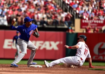 Oct 3, 2021; St. Louis, Missouri, USA;  Chicago Cubs shortstop Sergio Alcantara (51) turns a double play as St. Louis Cardinals second baseman Tommy Edman (19) slides during the third inning at Busch Stadium. Mandatory Credit: Jeff Curry-USA TODAY Sports