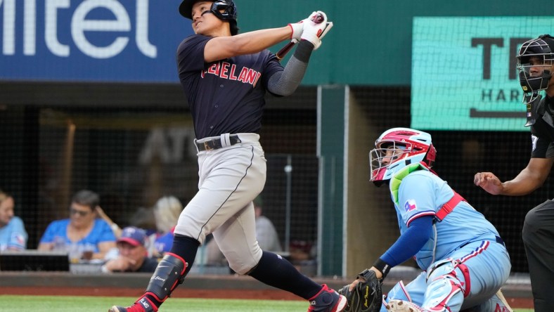 Oct 3, 2021; Arlington, Texas, USA; Cleveland Indians first baseman Yu Chang (2) follows though on his two-run home run against the Texas Rangers during the fifth inning at Globe Life Field. Mandatory Credit: Jim Cowsert-USA TODAY Sports