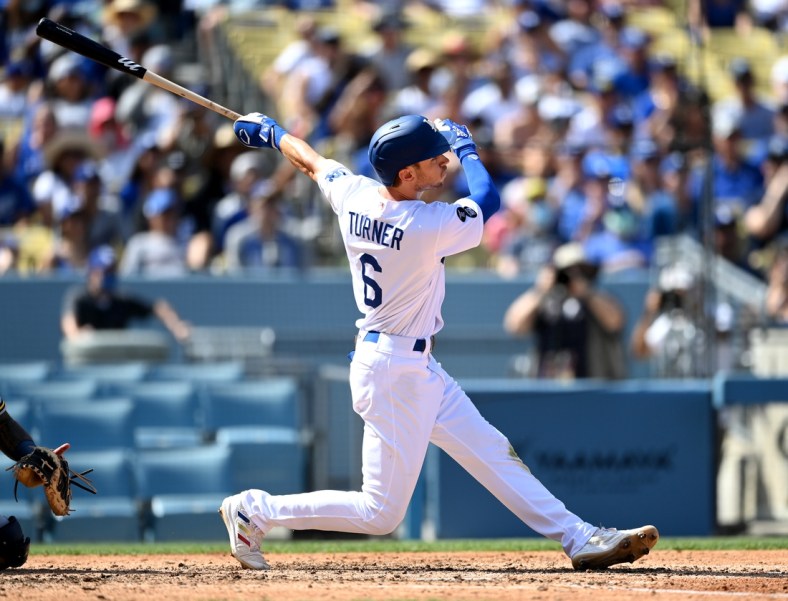 Oct 3, 2021; Los Angeles, California, USA;  Los Angeles Dodgers shortstop Trea Turner (6) hits a grand slam home run in the fifth inning of the game against the Milwaukee Brewers Dodger Stadium. Mandatory Credit: Jayne Kamin-Oncea-USA TODAY Sports