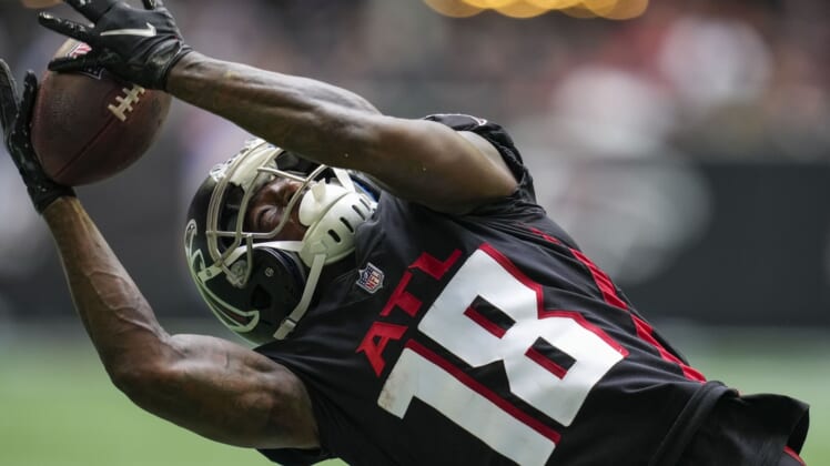 Oct 3, 2021; Atlanta, Georgia, USA; Atlanta Falcons wide receiver Calvin Ridley (18) tries to catch a pass against the Washington Football Team during the second half at Mercedes-Benz Stadium. Mandatory Credit: Dale Zanine-USA TODAY Sports
