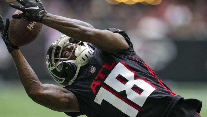 Oct 3, 2021; Atlanta, Georgia, USA; Atlanta Falcons wide receiver Calvin Ridley (18) tries to catch a pass against the Washington Football Team during the second half at Mercedes-Benz Stadium. Mandatory Credit: Dale Zanine-USA TODAY Sports