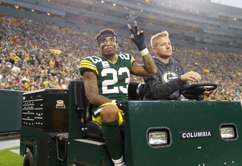 Oct 3, 2021; Green Bay, Wisconsin, USA;  Green Bay Packers cornerback Jaire Alexander (23) is driven from the field after being injured during the third quarter against the Pittsburgh Steelers at Lambeau Field. Mandatory Credit: Jeff Hanisch-USA TODAY Sports