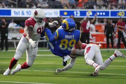 Oct 3, 2021; Inglewood, California, USA; Los Angeles Rams tight end Tyler Higbee (89) is tackled by Arizona Cardinals defensive end Michael Dogbe (91) and cornerback Byron Murphy (7) in the second half at SoFi Stadium. The Cardinals defeated the Rams 37-20. Mandatory Credit: Kirby Lee-USA TODAY Sports