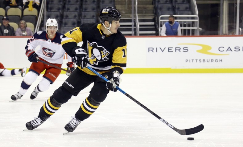 Sep 27, 2021; Pittsburgh, Pennsylvania, USA;  Pittsburgh Penguins center Brian Boyle (11)  skates with the puck against the Columbus Blue Jackets during the first period at PPG Paints Arena. Mandatory Credit: Charles LeClaire-USA TODAY Sports