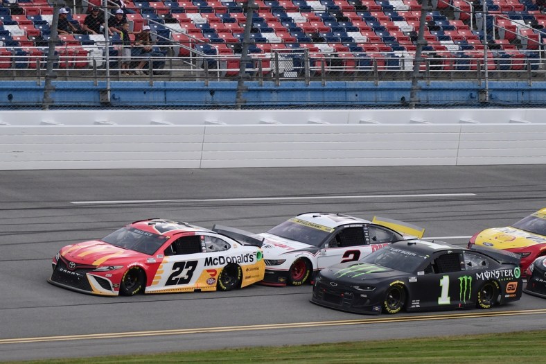 Oct 4, 2021; Talladega, Alabama, USA; NASCAR Cup Series driver Bubba Wallace (23) leads a pack of cars during the YellaWood 500 at Talladega Superspeedway. Mandatory Credit: Adam Hagy-USA TODAY Sports