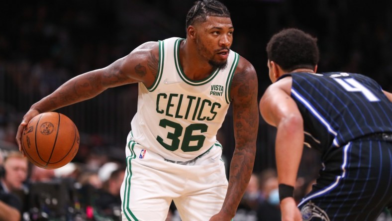 Oct 4, 2021; Boston, Massachusetts, USA; Boston Celtics guard Marcus Smart (36) controls the ball defended by Orlando Magic guard Jalen Suggs (4) during the second half at TD Garden. Mandatory Credit: Paul Rutherford-USA TODAY Sports