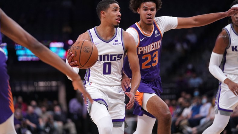 Oct 4, 2021; Sacramento, California, USA; Sacramento Kings guard Tyrese Haliburton (0) drives past Phoenix Suns forward Cameron Johnson (23) in the first quarter at the Golden 1 Center. Mandatory Credit: Cary Edmondson-USA TODAY Sports