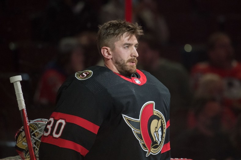 Oct 1, 2021; Ottawa, Ontario, CAN; Ottawa Senators goalie Matt Murray (30) stands for the National Anthem prior to start of game against the Montreal Canadiens at the Canadian Tire Centre. Mandatory Credit: Marc DesRosiers-USA TODAY Sports