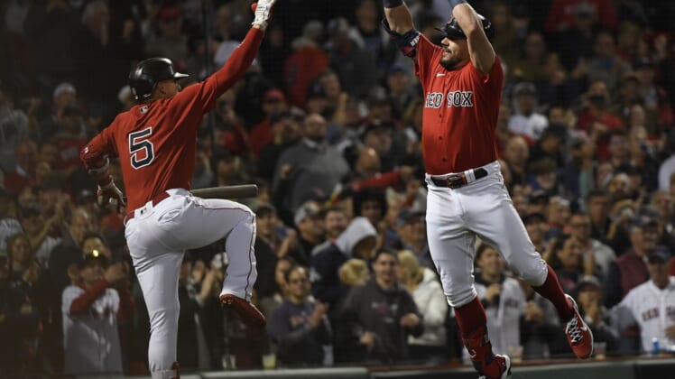 Oct 5, 2021; Boston, Massachusetts, USA; Boston Red Sox designated hitter Kyle Schwarber (18) celebrates with center fielder Enrique Hernandez (5) after hitting a solo home run against the New York Yankees during the third inning of the American League Wildcard game at Fenway Park. Mandatory Credit: Bob DeChiara-USA TODAY Sports