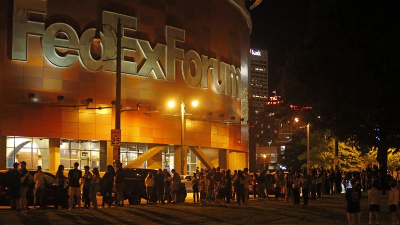 Oct 5, 2021; Memphis, Tennessee, USA; Fans wait outside of FedExForum after a fire stopped play during the third quarter of a game between the Memphis Grizzlies and the Milwaukee Bucks. Mandatory Credit: Petre Thomas-USA TODAY Sports