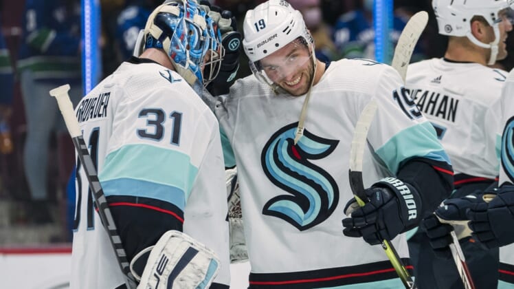 Oct 5, 2021; Vancouver, British Columbia, CAN; Seattle Kraken goalie Philipp Grubauer (31) and forward Calle Jarnkrok (19) celebrate after defeating the Vancouver Canucks at Rogers Arena. Seattle won 4-0. Mandatory Credit: Bob Frid-USA TODAY Sports