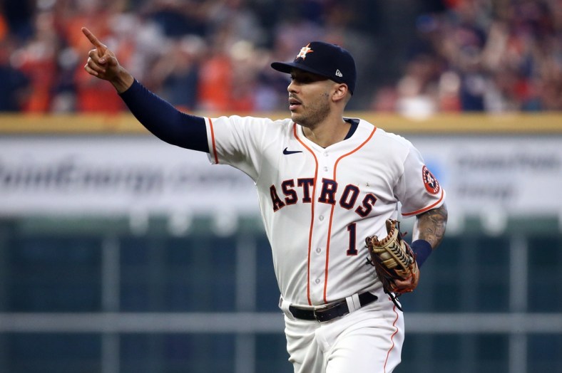 Oct 7, 2021; Houston, Texas, USA; Houston Astros shortstop Carlos Correa (1) reacts after Chicago White Sox center fielder Luis Robert (not pictured) was caught stealing during the second inning during game one of the 2021 ALDS at Minute Maid Park. Mandatory Credit: Troy Taormina-USA TODAY Sports