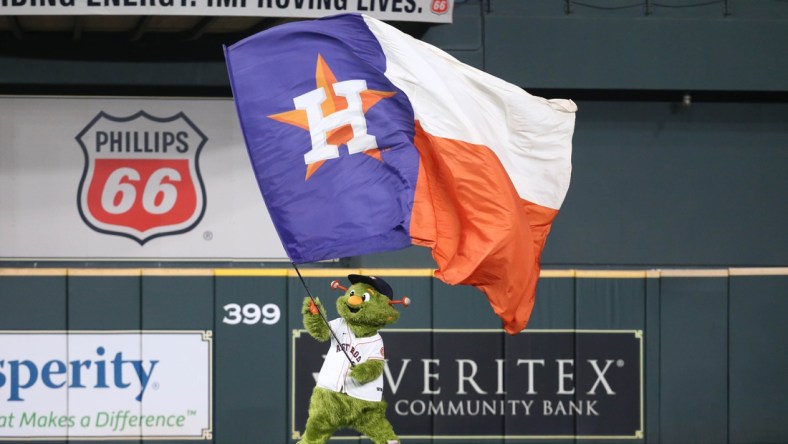 Oct 7, 2021; Houston, Texas, USA; Houston Astros mascot waves a flag after the Astros beat the Chicago White Sox in game one of the 2021 ALDS at Minute Maid Park. Mandatory Credit: Troy Taormina-USA TODAY Sports