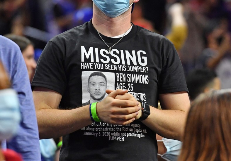 Oct 7, 2021; Philadelphia, Pennsylvania, USA;  Philadelphia 76ers fan wears a t-shirt referencing guard Ben Simmons who has not reported to training camp during the second quarter against the Toronto Raptors at Wells Fargo Center. Mandatory Credit: Eric Hartline-USA TODAY Sports