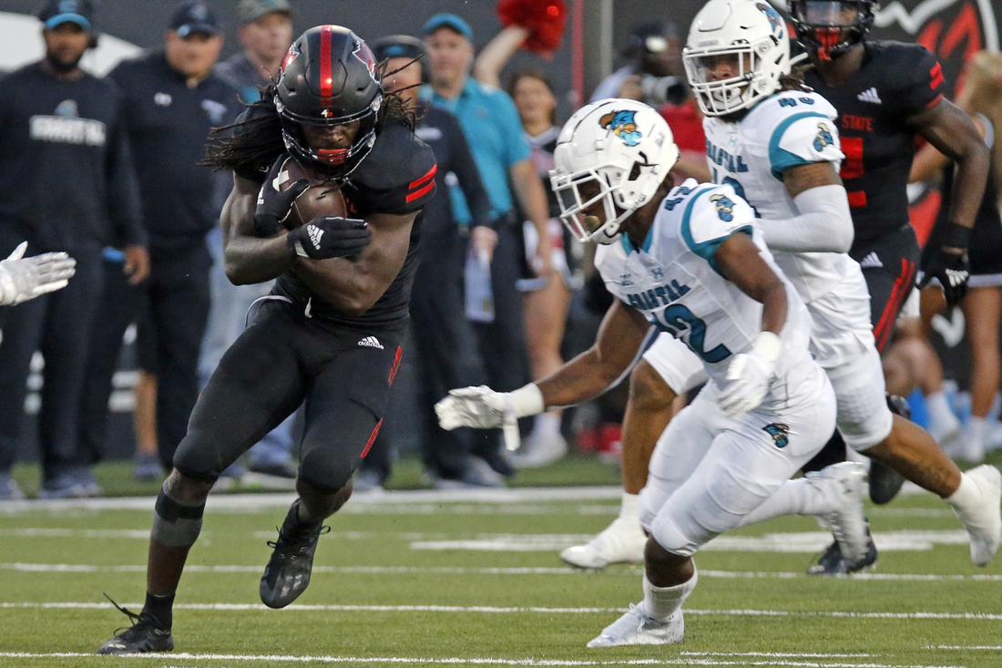 Oct 7, 2021; Jonesboro, Arkansas, USA; Arkansas State Red Wolves wide receiver Te'Vailance Hunt (10) runs after a catch as Coastal Carolina Chanticleers defensive back Tavyn Jackson (42) defends during the first half at Centennial Bank Stadium. Mandatory Credit: Petre Thomas-USA TODAY Sports