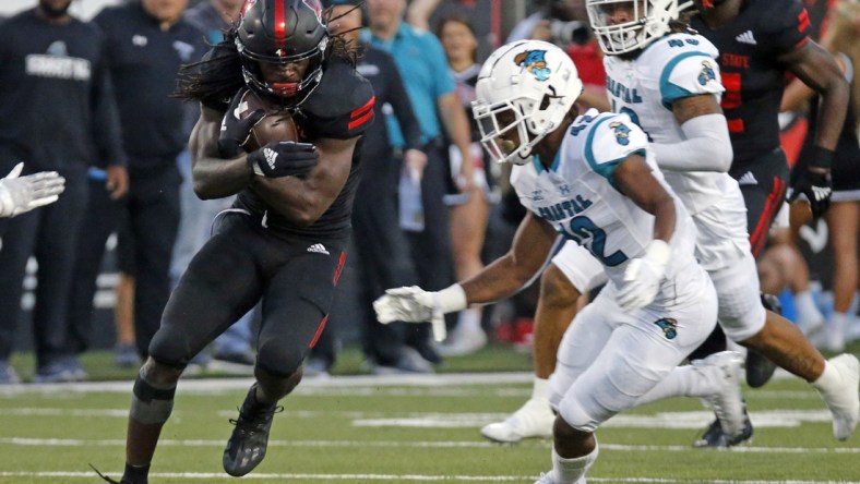 Oct 7, 2021; Jonesboro, Arkansas, USA; Arkansas State Red Wolves wide receiver Te'Vailance Hunt (10) runs after a catch as Coastal Carolina Chanticleers defensive back Tavyn Jackson (42) defends during the first half at Centennial Bank Stadium. Mandatory Credit: Petre Thomas-USA TODAY Sports