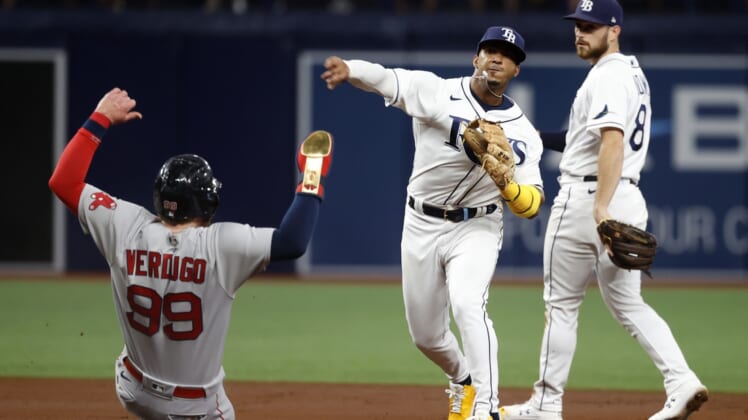 Oct 7, 2021; St. Petersburg, Florida, USA; Tampa Bay Rays shortstop Wander Franco (5) turns a double play during the second inning of game one of the 2021 ALDS against the Boston Red Sox at Tropicana Field. Mandatory Credit: Kim Klement-USA TODAY Sports