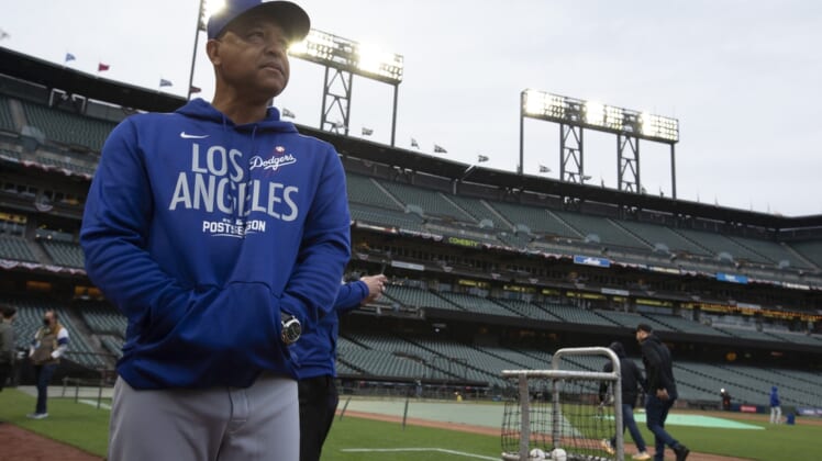 Oct 7, 2021; San Francisco, CA, USA; Los Angeles Dodgers manager Dave Roberts (30) watches his players during NLDS workouts. Mandatory Credit: D. Ross Cameron-USA TODAY Sports