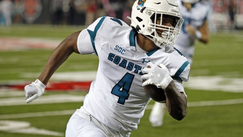 Oct 7, 2021; Jonesboro, Arkansas, USA; Coastal Carolina Chanticleers tight end Isaiah Likely (4) runs after the catch for a touchdown during the second half against the Arkansas State Red Wolves at Centennial Bank Stadium. Mandatory Credit: Petre Thomas-USA TODAY Sports