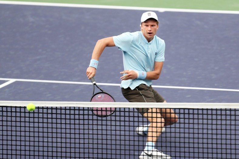 American Jenson Brooksby returns a shot to Cem Ilkel of Turkey on Stadium One at the BNP Paribas Open in Indian Wells, Calif., on October 8, 2021. Brooksby won in two sets.

Jenson Brooksby Vs Cem Ilkel Bnp Paribas2050