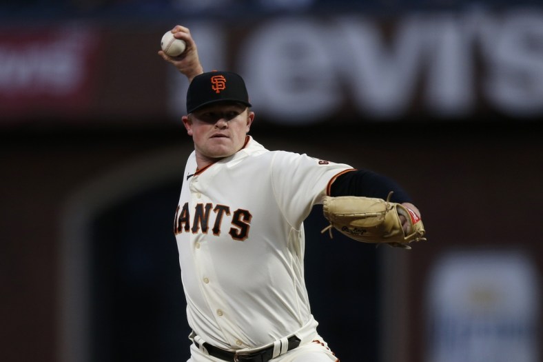 Oct 8, 2021; San Francisco, California, USA; San Francisco Giants starting pitcher Logan Webb (62) pitches in the first inning against the Los Angeles Dodgers during game one of the 2021 NLDS at Oracle Park. Mandatory Credit: D. Ross Cameron-USA TODAY Sports