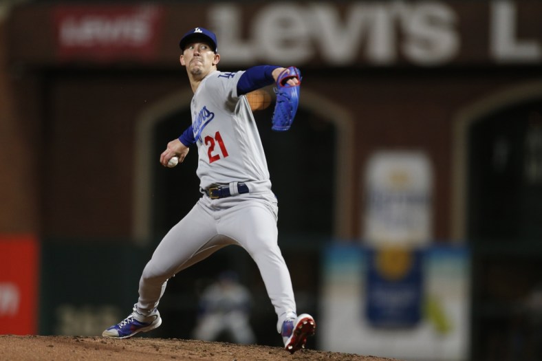 Oct 8, 2021; San Francisco, California, USA; Los Angeles Dodgers starting pitcher Walker Buehler (21) pitches against the San Francisco Giants in the fourth inning during game one of the 2021 NLDS at Oracle Park. Mandatory Credit: D. Ross Cameron-USA TODAY Sports