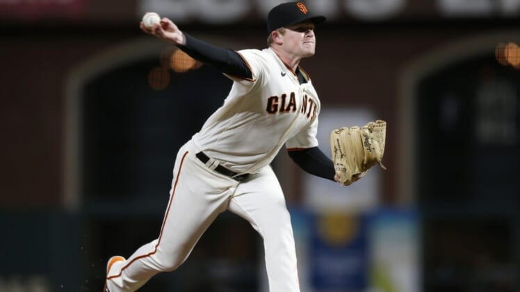 Oct 8, 2021; San Francisco, California, USA; San Francisco Giants starting pitcher Logan Webb (62) pitches against the Los Angeles Dodgers in the sixth inning during game one of the 2021 NLDS at Oracle Park. Mandatory Credit: D. Ross Cameron-USA TODAY Sports