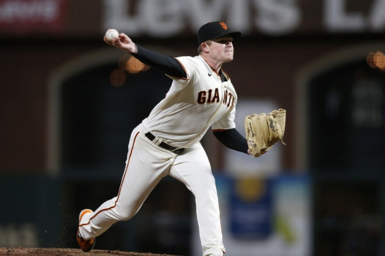 Oct 8, 2021; San Francisco, California, USA; San Francisco Giants starting pitcher Logan Webb (62) pitches against the Los Angeles Dodgers in the sixth inning during game one of the 2021 NLDS at Oracle Park. Mandatory Credit: D. Ross Cameron-USA TODAY Sports