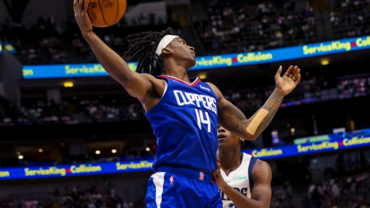 Oct 8, 2021; Dallas, Texas, USA;  LA Clippers guard Terance Mann (14) grabs a rebound during the second half against the Dallas Mavericks at American Airlines Center. Mandatory Credit: Kevin Jairaj-USA TODAY Sports
