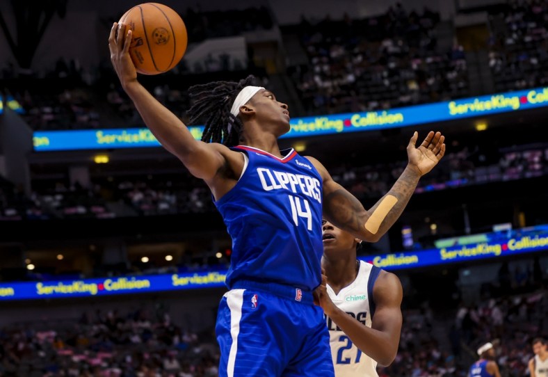Oct 8, 2021; Dallas, Texas, USA;  LA Clippers guard Terance Mann (14) grabs a rebound during the second half against the Dallas Mavericks at American Airlines Center. Mandatory Credit: Kevin Jairaj-USA TODAY Sports
