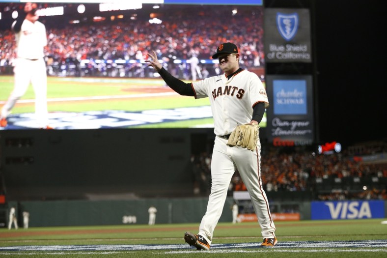 Oct 8, 2021; San Francisco, California, USA; San Francisco Giants starting pitcher Logan Webb (62) walks off the field after being relieved in the eighth inning against the Los Angeles Dodgers during game one of the 2021 NLDS at Oracle Park. Mandatory Credit: D. Ross Cameron-USA TODAY Sports