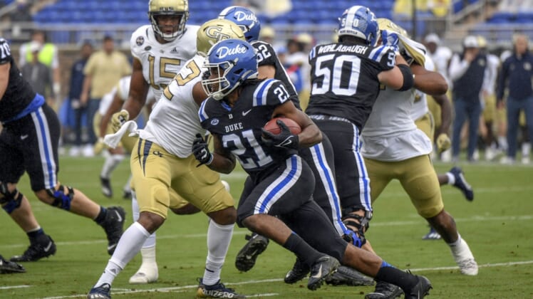 Oct 9, 2021; Durham, North Carolina, Duke Blue Devils running back Mataeo Durant (21) runs the ball against the Georgia Tech Yellow Jackets during the first quarter at Wallace Wade Stadium. Mandatory Credit: William Howard-USA TODAY Sports.