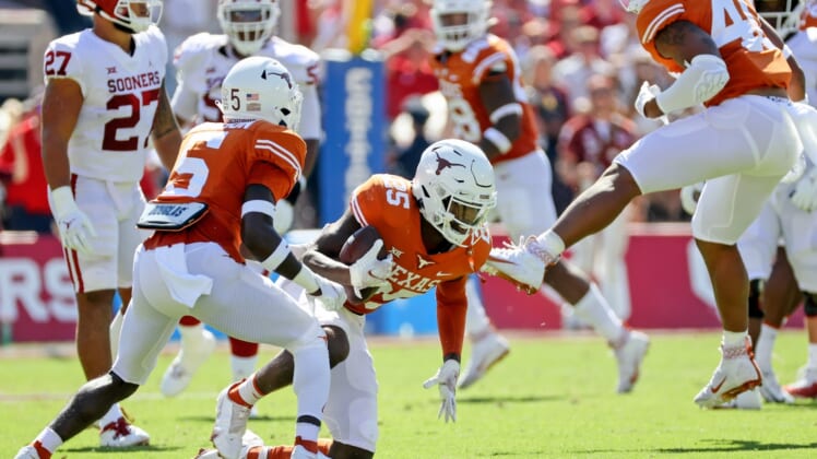 Oct 9, 2021; Dallas, Texas, USA; Texas Longhorns defensive back B.J. Foster (25) reacts after intercepting a pass against the Oklahoma Sooners during the first quarter at the Cotton Bowl. Mandatory Credit: Kevin Jairaj-USA TODAY Sports