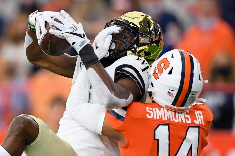 Oct 9, 2021; Syracuse, New York, USA; Wake Forest Demon Deacons wide receiver Jaquarii Roberson (5) catches the ball as Syracuse Orange defensive back Jason Simmons (14) defends during the first half at the Carrier Dome. Mandatory Credit: Rich Barnes-USA TODAY Sports