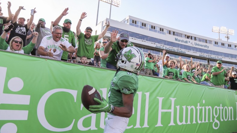 Oct 9, 2021; Huntington, West Virginia, USA; Marshall Thundering Herd wide receiver Shadeed Ahmed (0) celebrates with fans after catching a touchdown pass during the first overtime against the Old Dominion Monarchs at Joan C. Edwards Stadium. Mandatory Credit: Ben Queen-USA TODAY Sports