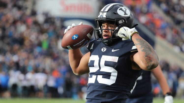 Oct 9, 2021; Provo, Utah, USA; Brigham Young Cougars running back Tyler Allgeier (25) reacts to scoring a touchdown in the fourth quarter at LaVell Edwards Stadium. Mandatory Credit: Rob Gray-USA TODAY Sports