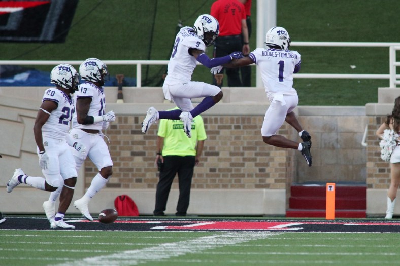 Oct 9, 2021; Lubbock, Texas, USA;  Texas Christian Horned Frogs defensive corner back Tre Vius Hodges-Thomlison (1) and defensive corner back C.J. Ceaser (9) react after scoring a touchdown against the Texas Tech Red Raiders in the first half at Jones AT&T Stadium. Mandatory Credit: Michael C. Johnson-USA TODAY Sports