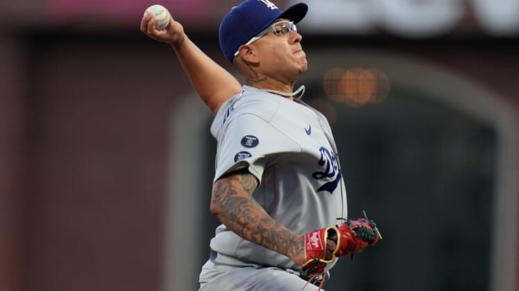 Oct 9, 2021; San Francisco, California, USA; Los Angeles Dodgers starting pitcher Julio Urias (7) throws against the San Francisco Giants in the first inning during game two of the 2021 NLDS at Oracle Park. Mandatory Credit: Neville E. Guard-USA TODAY Sports