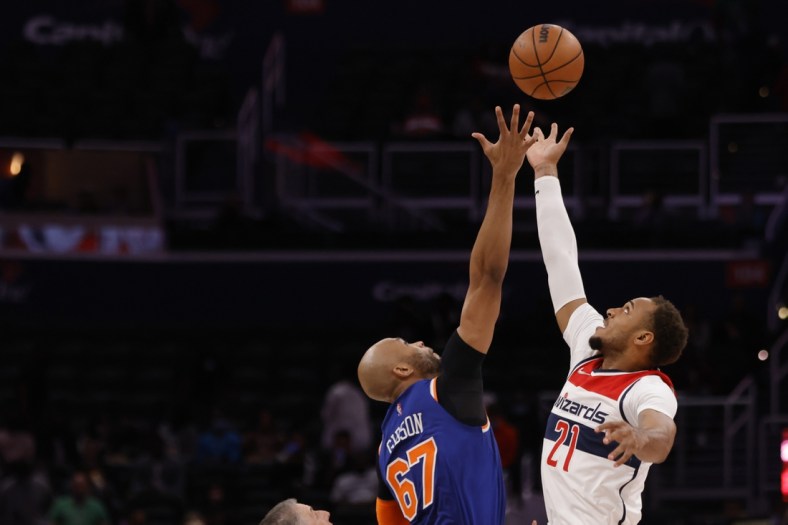 Oct 9, 2021; Washington, District of Columbia, USA; Washington Wizards center Daniel Gafford (21) and New York Knicks center Taj Gibson (67) vie for the opening tip at Capital One Arena. Mandatory Credit: Geoff Burke-USA TODAY Sports