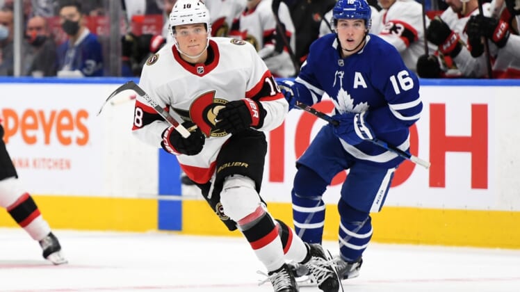 Oct 9, 2021; Toronto, Ontario, CAN;   Ottawa Senators forward Tim Stutzle (18) pursues the play ahead of Toronto Maple Leafs forward Mitch Marner (16) in the third period at Scotiabank Arena. Mandatory Credit: Dan Hamilton-USA TODAY Sports