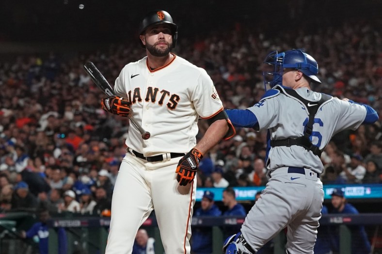 Oct 9, 2021; San Francisco, California, USA; San Francisco Giants left fielder Darin Ruf (33) reacts after striking out against the Los Angeles Dodgers in the third inning during game two of the 2021 NLDS at Oracle Park. Mandatory Credit: Neville E. Guard-USA TODAY Sports