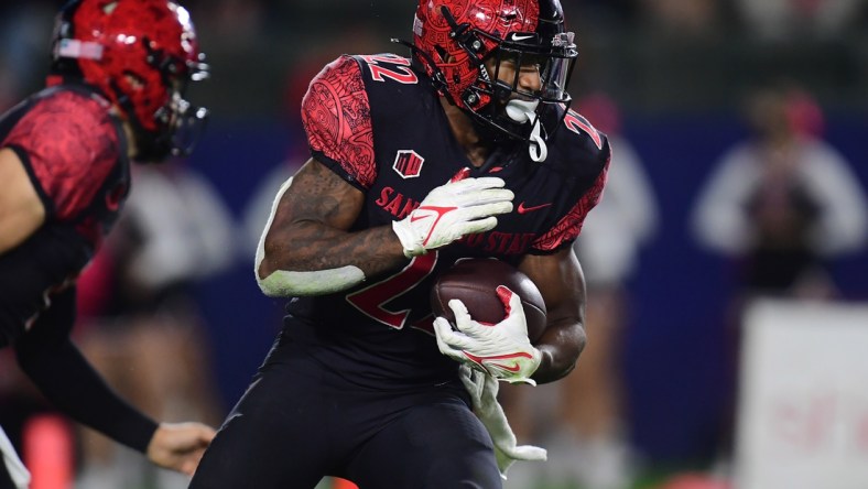 Oct 9, 2021; Carson, California, USA; San Diego State Aztecs running back Greg Bell (22) runs the ball against the New Mexico Lobos during the second half at Dignity Health Sports Park. Mandatory Credit: Gary A. Vasquez-USA TODAY Sports