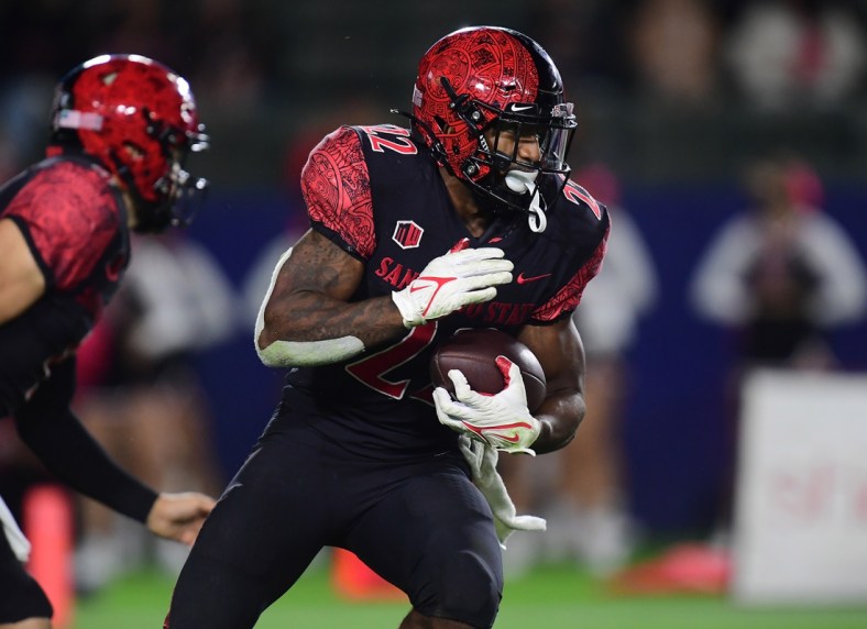 Oct 9, 2021; Carson, California, USA; San Diego State Aztecs running back Greg Bell (22) runs the ball against the New Mexico Lobos during the second half at Dignity Health Sports Park. Mandatory Credit: Gary A. Vasquez-USA TODAY Sports
