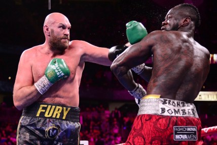 Oct 9, 2021; Las Vegas, Nevada, USA; Deontay Wilder (red/black trunks) and Tyson Fury (black/gold trunks) box during their WBC/Lineal heavyweight championship boxing match at T-Mobile Arena. Mandatory Credit: Joe Camporeale-USA TODAY Sports