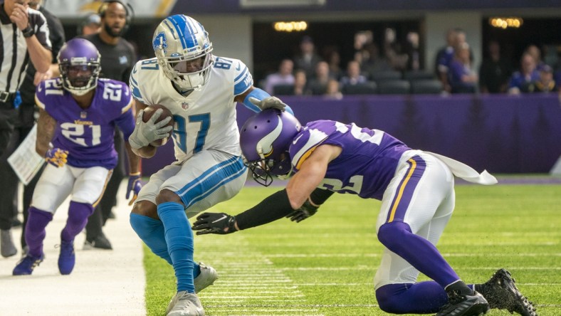 Oct 10, 2021; Minneapolis, Minnesota, USA; Detroit Lions wide receiver Quintez Cephus (87) is pushed out of bounds by Minnesota Vikings safety Harrison Smith (22) in the first quarter at U.S. Bank Stadium. Mandatory Credit: Matt Blewett-USA TODAY Sports