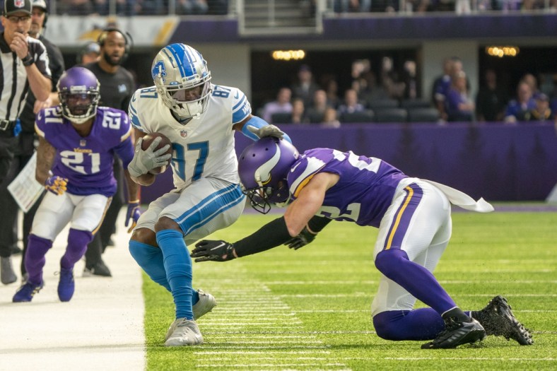 Oct 10, 2021; Minneapolis, Minnesota, USA; Detroit Lions wide receiver Quintez Cephus (87) is pushed out of bounds by Minnesota Vikings safety Harrison Smith (22) in the first quarter at U.S. Bank Stadium. Mandatory Credit: Matt Blewett-USA TODAY Sports
