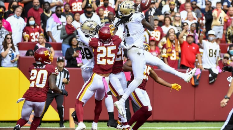Oct 10, 2021; Landover, Maryland, USA; New Orleans Saints wide receiver Marquez Callaway (1) catches a touchdown  pass against the Washington Football Team during the first half at FedExField. Mandatory Credit: Brad Mills-USA TODAY Sports